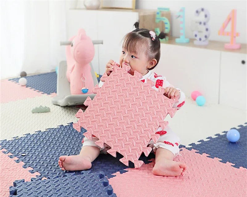 baby teething on a non-toxic foam floor tile